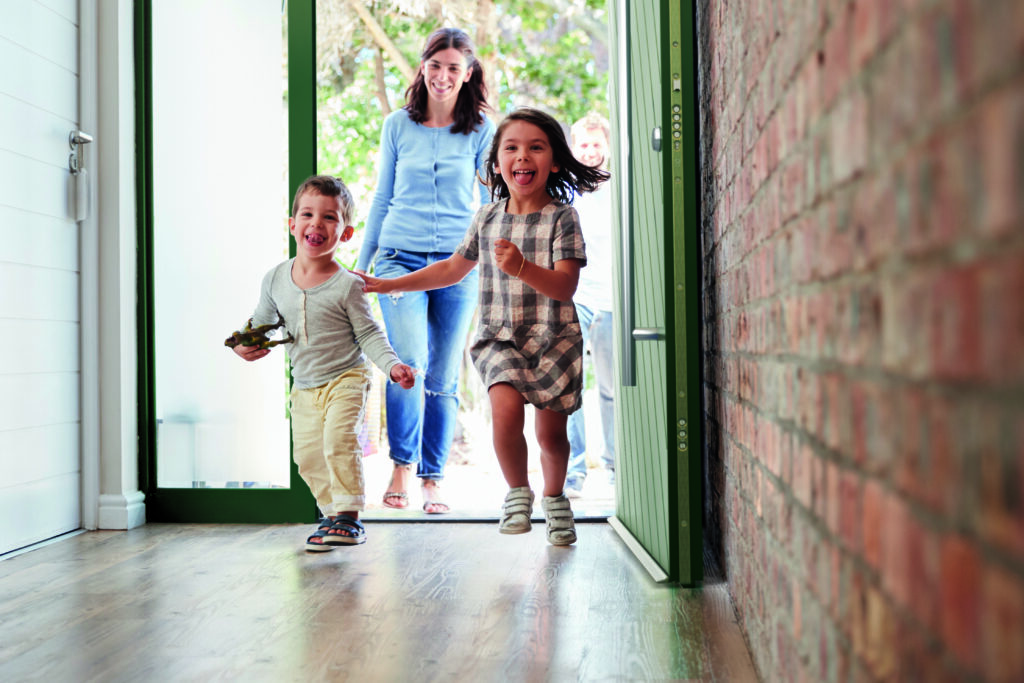 Excited Children Arriving Home With Parents | Aluminium Composite Doors Whether it’s keeping outdoor noise out or family fun in, an aluminium composite door is the perfect choice—because aluminium composite doors are built for real-life living